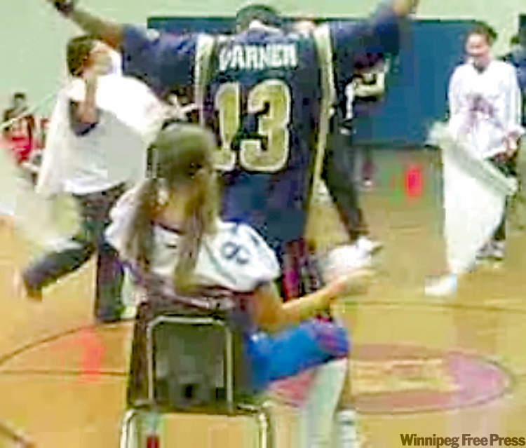 Two teachers perform a simulated lap dance at Churchill High School.