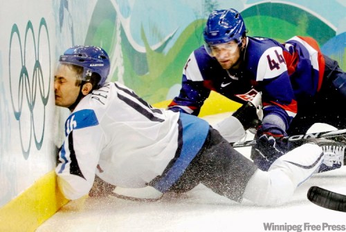 Julie Jacobson / The Associated Press
Collisions with the boards or with other players can cause skull or facial fractures that a helmet and faceguard can help prevent. But researchers say a hockey helmet has not yet been made that will help prevent concussions caused by the brain sloshing around inside the skull.