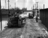 Winnipeg Free Press files
Workers build a mud dike north of  Provencher Bridge near downtown Winnipeg in 1950. The St. Boniface Basilica is in the background.