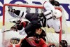 Vancouver’s Mark Messier slams into the post after scoring a goal against Calgary in this 1998 photo. Messier sustained a concussion on the play.