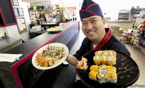 JOE.BRYKSA@FREEPRESS.MB.CA 
Il Jae Shin shows off fresh sushi, prepared at small lunch counter in the middle of Hyundae Market on Grant Avenue.