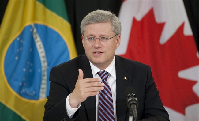 Prime Minister Stephen Harper speaks to members of the Canadian and Brazilian business community at the start of a meeting in Sao Paulo, Tuesday August 9, 2011. Harper commented on the present financial situation affecting the world economy. THE CANADIAN PRESS/Adrian Wyld