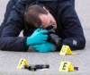 WAYNE GLOWACKI / WINNIPEG FREE PRESS
A police officer photographs bullet and a handgun on Stafford Street at Hector Ave near the Salisbury House Rest. on Pembina Hwy., where shots were fired early Thursday morning.