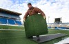 Wayne Glowacki / Winnipeg Free Press
Todd Leathwood cuts pieces of the turf at the Canad Inns Stadium that will become part of framed memory collections. Everything at the stadium that hasn't been claimed yet is for sale.