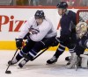 Wayne Glowacki / Winnipeg Free Press
Jets defenceman Zach Redmond (left), nearly fully recovered from a horrifying injury in February, is chased by James Wright at the team's optional practice Friday.