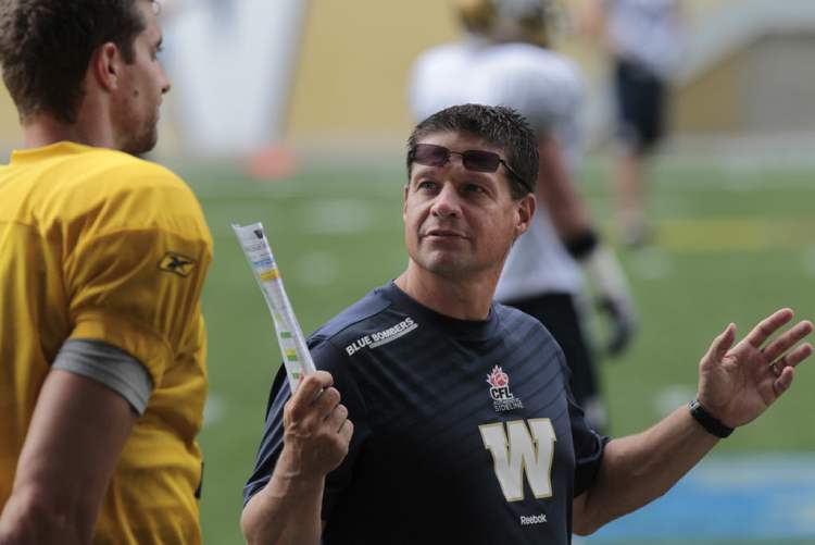 WAYNE GLOWACKI / WINNIPEG FREE PRESS Archives
Offensive co-ordinator Marcel Bellefeuille works with starting quarterback Justin Goltz at a Bomber workout.