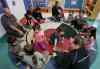 Wayne Glowacki / Winnipeg Free Press 
Madison (right) and Miley, with an eagle feather, move a smudge around a circle as part of the Little Red Spirit Aboriginal Head Start program.