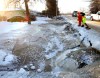 Wayne Glowacki / Winnipeg Free Press 
City crews work along the ditch on Laxdal Road near Ridgewood Avenue after a major water main break Sunday.