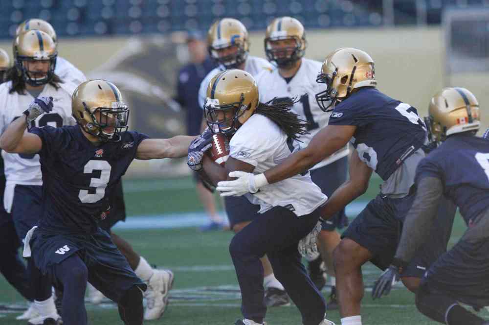 Wayne Glowacki / Winnipeg Free Press
Winnipeg Blue Bomber #34 running back Paris Cotten with the ball at the team practice at Investors Group Field.