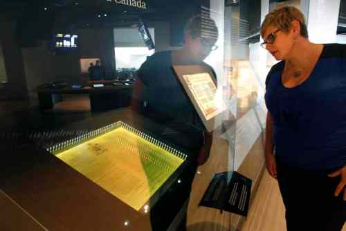 WAYNE GLOWACKI / WINNIPEG FREE PRESS
Heather Bidzinski views the Proclamation of the Constitution Act document at the Canadian Museum for Human Rights Wednesday.