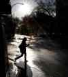 WAYNE GLOWACKI / WINNIPEG FREE PRESS
Blazing sunshine early Friday morning reflects on the wet street of Broadway -- but more rain is in the forecast for the weekend.