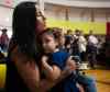 MIKAELA MACKENZIE / WINNIPEG FREE PRESS
Charlotte Boubard holds her  daughter, Toni, while singing at Winnipeg's Thunderbird House after the Walk for  Reconciliation  on Tuesday.