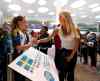 Wayne Glowacki / Winnipeg Free Press
Sofia Jakobsson signs a poster for Jax Correia, a player on the St. Charles Force, after Team Sweden arrived at the Richardson International Airport this afternoon to compete in the FIFA Women's World Cup Canada 2015.
