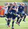 WAYNE GLOWACKI / WINNIPEG FREE PRESS
Team Sweden, including Nilla Fischer in foreground, do some twists during the warm up at the team practice at the Winnipeg Soccer Complex Thursday preparing for the game against the USA Friday.