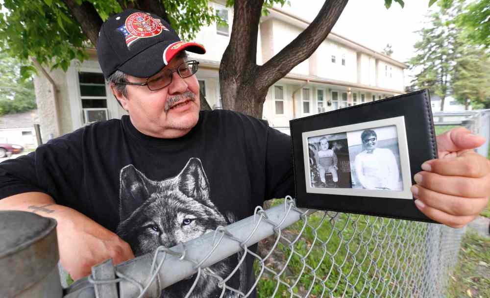 WAYNE GLOWACKI / WINNIPEG FREE PRESS
Peter Froese, who was caught up in the 60's scoop is now 53. He is applying to get his original adoption records that he hopes will illuminate why he was taken from his mother as a toddler. He is holding a picture frame containing a picture of his mother Mildrid Thomas taken in the late 1960's and a photo of himself 18 months old with the Froese family taken May 1963.