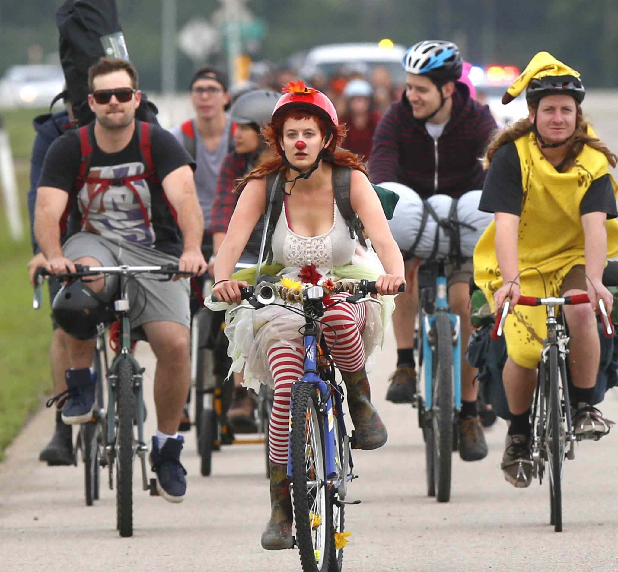 Cyclists head out to Birds Hill for prime Folk Fest campsites