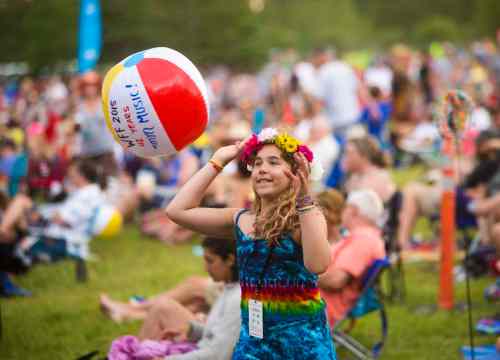 Winnipeg Free Press
Chiara Kivilaht, 10, tosses a beach ball through the crowd at the Winnipeg Folk Festival at Birds Hill Provincial Park on Saturday, July 11, 2015.   Mikaela MacKenzie / Winnipeg Free Press