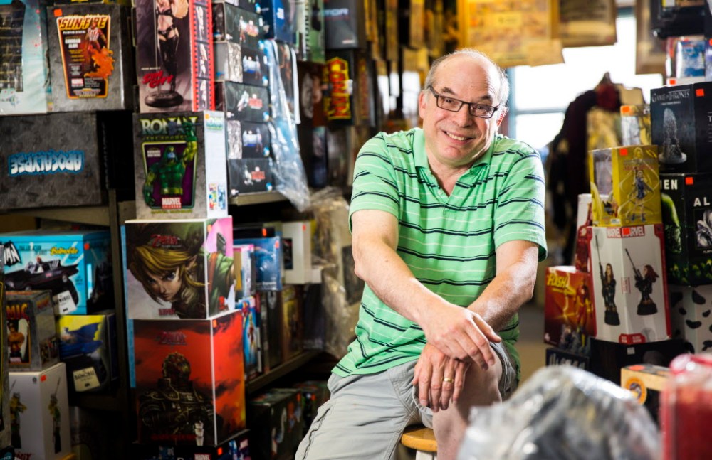 (Mikaela MacKenzie / Winnipeg Free Press
Joe Krolik, owner of Comics America, in his store filled with comics and pop culture memorabilia.