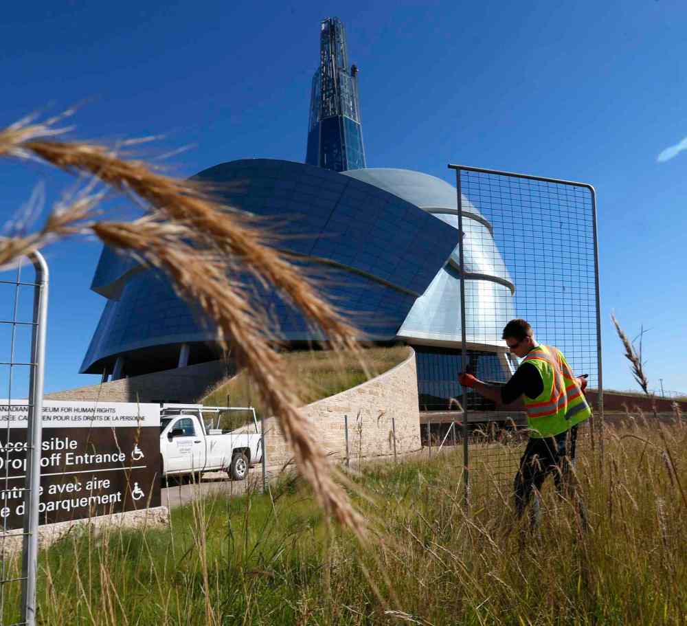 Fences surrounding CMHR indigenous prairie grass come down Winnipeg