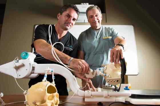 SubmittedDr. Mark Torchia (right) first envisioned the NeuroBlate in the early 1990s and was joined in the quest by Richard Tyc in 1998. It is now in use in 35 locations across North America.