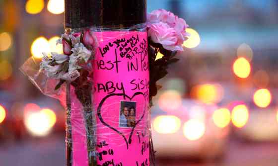 Wayne Glowacki / Winnipeg Free PressA memorial was placed on a pole on Portage Avenue at Good Street, the scene of an SUV crash Monday morning.