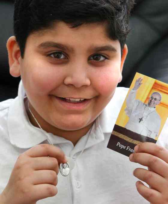 WAYNE GLOWACKI / WINNIPEG FREE PRESSGrade 4 student Ryan K. had a chance to meet Pope Francis at the Vatican last week. He is holding a Pope Francis medallion he received on the trip.