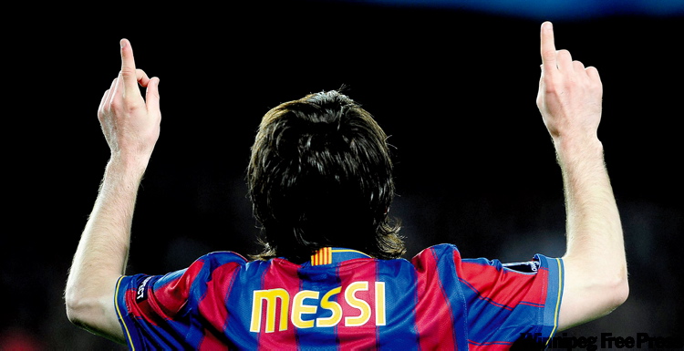 Manu Fernandez / the associated press archives
Barcelona's Lionel Messi celebrates after netting one of his four goals against Arsenal in a Champions League quarter-final second-leg match in Camp Nou Stadium Tuesday.
