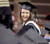 RUTH.BONNEVILLE@FREEPRESS.MB.CA
Jessica Ann Flynn flashes a big smile at fellow graduates as she makes her way up to the podium to receive her bachelor of education degree during the 131st annual U of M convocation at the Investors Group Athletic Centre Tuesday.