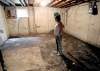 MIKE.DEAL@FREEPRESS.MB.CA
Roberta Jessamine in her oldest son’s former bedroom, now contaminated and destroyed by nearly foot-deep sewer backup.