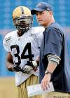 JOE.BRYKSA@FREEPRESS.MB.CA 
RB Emmanuel Marc chats with head coach Paul LaPolice during a workout.