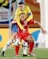Ivan Sekretarev/ The Associated Press
Brazil's Lucio (back) tackles North Korea's Jong Tae Se during their Group G match at Ellis Park Stadium on Tuesday.