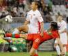 KIN CHEUNG / THE ASSOCIATED PRESS
Portugal's Pedro Mendes (right) stretches for the ball against North Korea's Jong Tae Se during Monday's rout.
