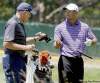 Orville Myers / MCT archives
Tiger can't argue with Steve Williams this time. He's on the green and his caddy has given him a putter.