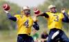 WAYNE.GLOWACKI@FREEPRESS.MB.CA
Buck Pierce (left) and Steven Jyles, rearing back in tandem to fire long bombs at practice, give the Bombers a 1-2 punch at quarterback.