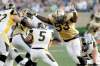 John Woods / the canadian press archives
Phillip Hunt (53) is a split-second away from pulverizing Ticats QB Kevin Glenn in first-half action last Friday.