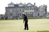 peter morrison / the associated press
Tiger Woods putts out on the treacherous 17th hole at the Old Course at St Andrews Monday. The hole has ended many a British Open run.