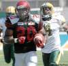 BRYAN SCHLOSSER / POSTMEDIA NEWS
Saskatchewan's Wes Cates, all decked out in the Green Riders' black and burgundy 1912 jersey, is end zone bound Saturday.