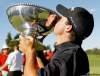 TREVOR HAGAN / WINNIPEG FREE PRESS
Aaron Goldberg's reflection is seen as he kisses the Players Cup trophy Sunday at Pine Ridge. The Californian won the tournament by one shot over Jim Rutledge.