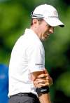 Aaron Lynett / postmedia news
Mike Weir grabs his right arm as tendinitis pain flares after he hit a tee shot on hole 11 in the pro-am at the RBC Canadian Open at St. George's Golf and Country Club in Toronto.

, Wednesday morning, July 21, 2010. Weir pulled out of the pro-am at the St. George�s G&CC after 15 holes, citing a sore arm.  ( National Post)   //NATIONAL POST STAFF PHOTO