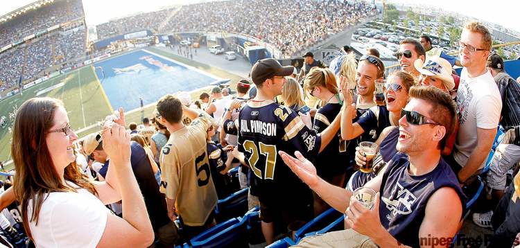 PHOTOS BY TREVOR HAGAN / WINNIPEG FREE PRESS
Fun times, good friends, warm weather, cold beer and, uh, football were the order of the evening for the fans in Section S.