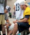JOE.BRYKSA@FREEPRESS.MB.CA
Injured Bombers starting quarterback Buck Pierce gets his knee iced by training staff during practice Thursday.