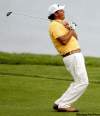 CHARLIE NEIBERGALL / THE ASSOCIATED PRESS
Phil Mickelson finds the beach on the 16th hole while completing his first round Friday at the fog-delayed PGA Championship.