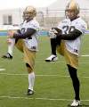 DAVID LIPNOWSKI / WINNIPEG FREE PRESS
Potential Blue Bombers placekickers Ryan Elaschuk (left) and Warren Kean limber up before putting their best feet forward at practice Sunday at Canad Inns Stadium. Justin Palardy was also vying for the spot in Thursday's game in Montreal.