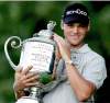 CHARLIE NEIBERGALL / THE ASSOCIATED PRESS
Germany’s Martin Kaymer holds the Wanamaker Trophy after winning the PGA Championship in a playoff Sunday.