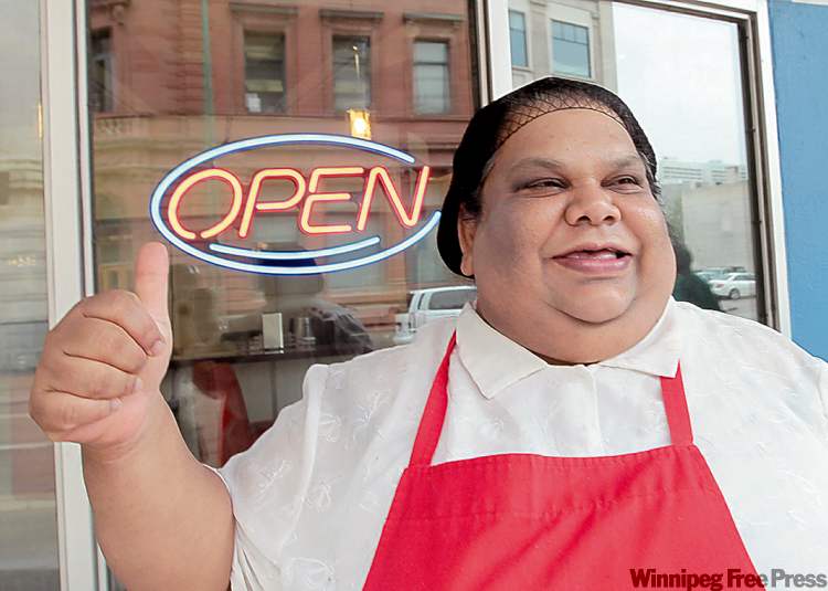 JOE.BRYKSA@FREEPRESS.MB.CA
Famena Ally gives the thumbs-up outside Famena's Famous Roti/Curry on Garry Street.