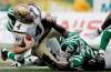 JOHN WOODS / THE CANADIAN PRESS
Winnipeg quarterback Buck Pierce (4) is injured while being sacked by Saskatchewan's Jerrell Freeman (left) and Barrin Simpson in the fourth quarter Sunday.