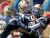 JOE.BRYKSA@FREEPRESS.MB.CA  
Blue Bomber Brandon Stewart (right) celebrates his recovery of a muffed Saskatchewan kickoff return with a little help from his friends. The turnover set up an eventual Winnipeg field goal.
