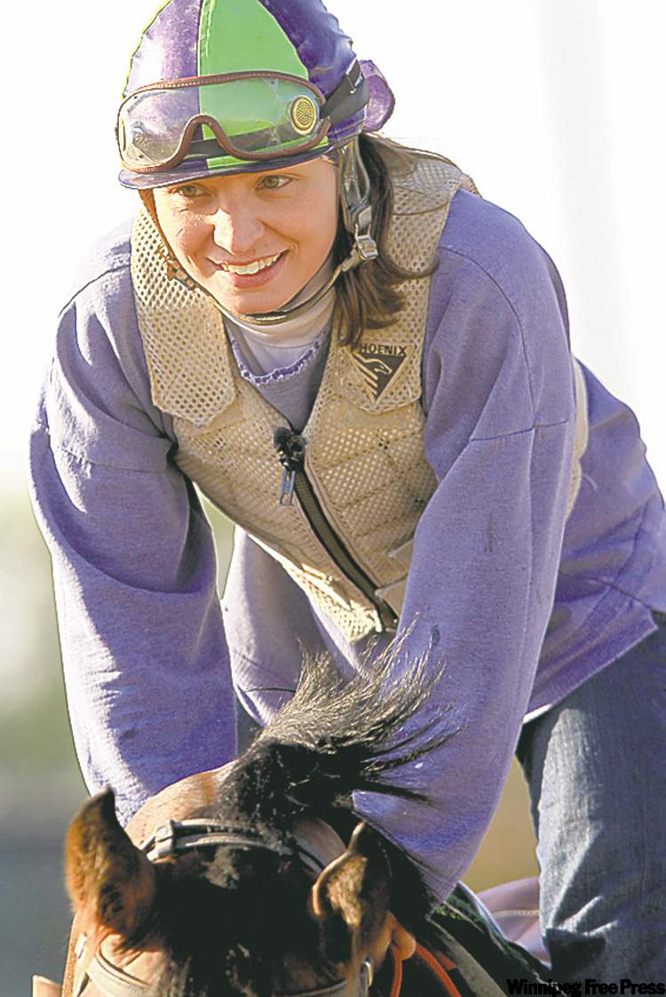 JANEK LOWE / WINNIPEG FREE PRESS
Janine Stianson takes Smoke'em All for a ride at Assiniboia Downs.