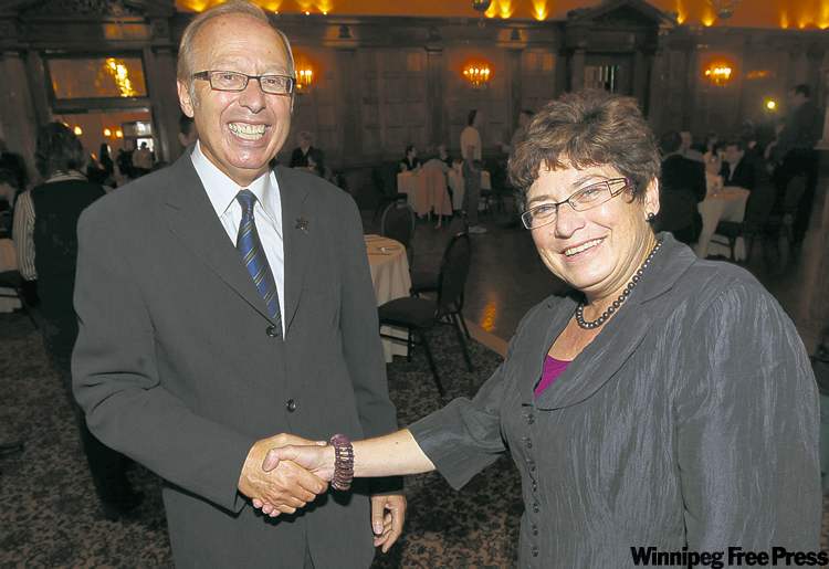 JOE.BRYKSA@FREEPRESS.MB.CA
Mayor Sam Katz and opponent Judy Wasylycia-Leis shake hands during a forum at the Fort Garry Hotel Monday.
