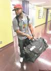 JOE.BRYKSA@FREEPRESS.MB.CA 
Jonathan Hefney hauls his luggage upon arrival at Richardson International Airport Tuesday afternoon.